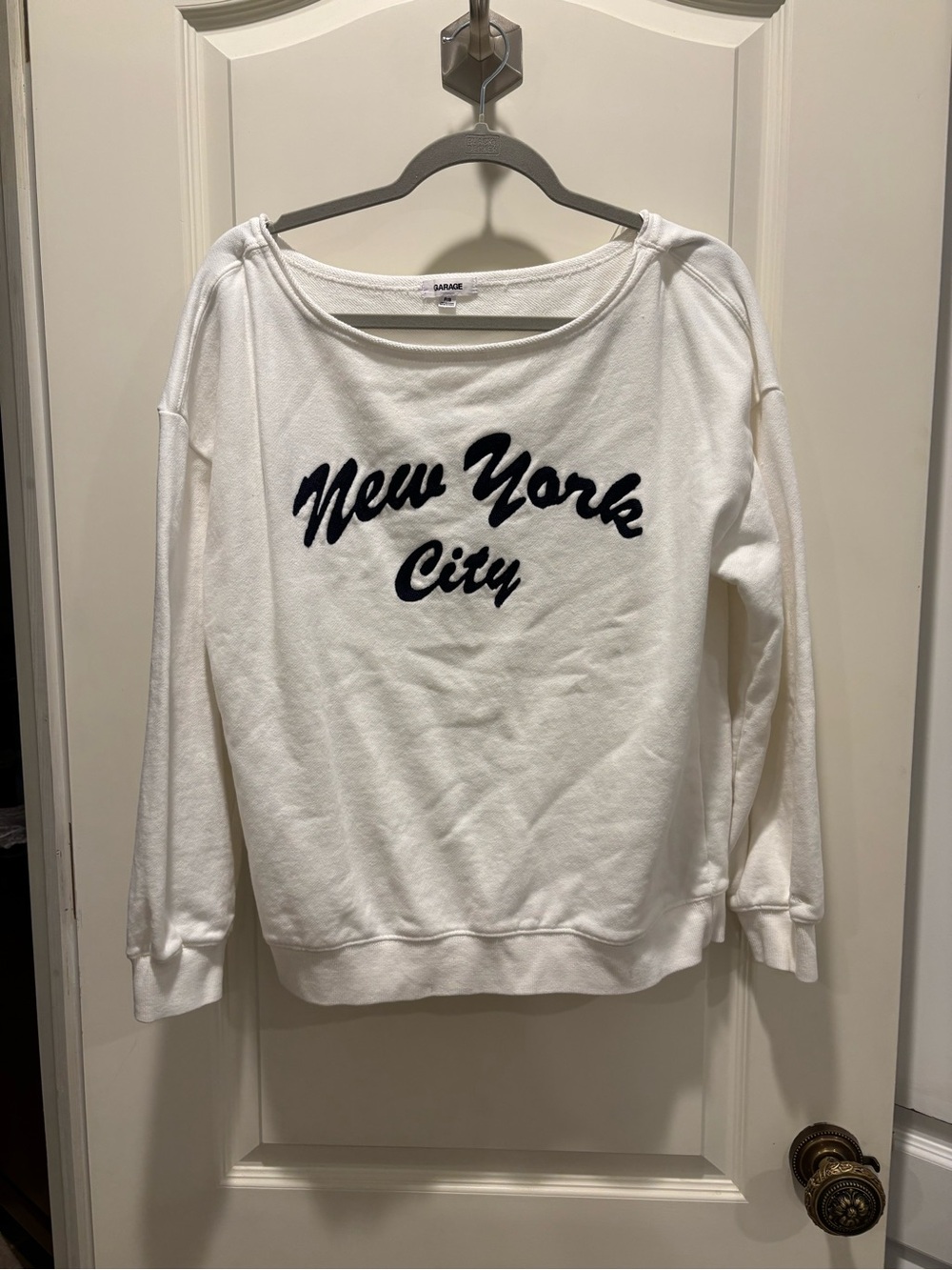 Garage White Off the Shoulder Sweatshirt with Navy NYC Script